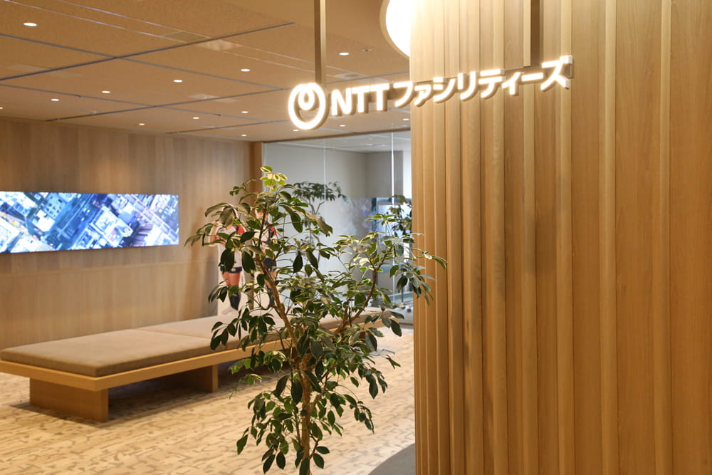 Entrance featuring the redesigned NTT Group logo for NTT’s new stage in facility solutions