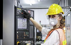 Image: Industrial Worker Wearing Gloves Using PCAP Touch Screen